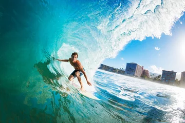 Fotobehang Surfer on Blue Ocean Wave in the Tube Getting Barreled © EpicStockMedia