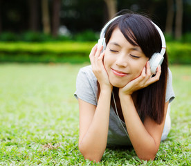 Asian woman enjoy music