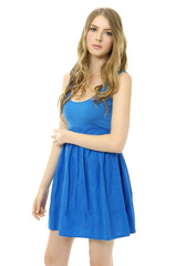 Portrait of trendy young woman in blue dress