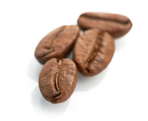 Macro of coffee beans isolated on white background