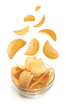 Bowl of patato chips isolated on white