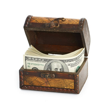 Dollar-bills in the old wooden treasure chest
