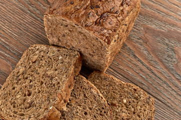 Slices of brown bread on a wooden table