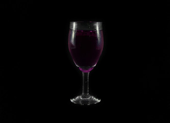 purple water drink in wine glass