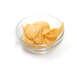 Delicious potato chips in bowl isolated on white