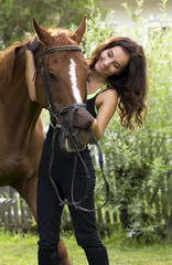 Fototapeta premium Woman holding horse