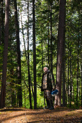 Mature man in pine forest