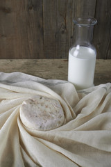 Fresh feta cheese with bottle of milk
