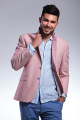 casual man raises his lapel