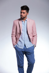 Fototapeta premium casual man with hands in pockets looks away