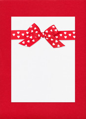 red bow on paper sheet