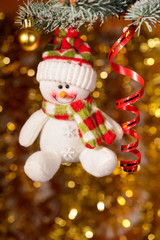 christmas snowman on fir tree branch