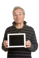 Senior Caucasian man portrait series, showing tablet computer