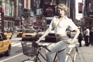 Fototapeta na wymiar sensual blonde girl with bicycle