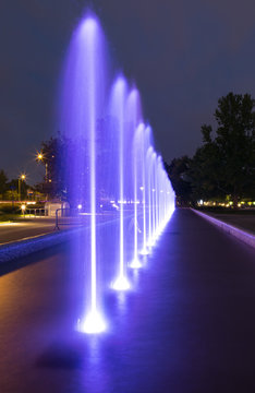 Fototapeta The illuminated fountain at night