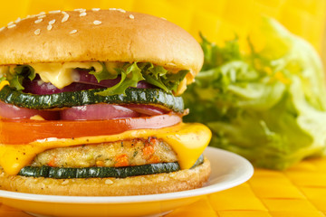 Vegetarian burger closeup , lettuce in background