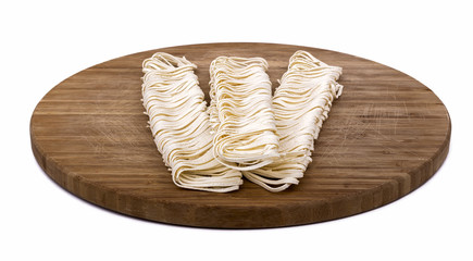 Pasta on Wooden Cutting Board. White background