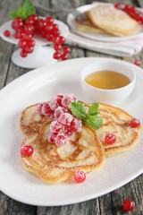 Pancakes with red currant and honey