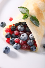 Pancakes with cream and fresh blueberries 