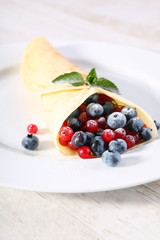 Pancakes with cream and fresh blueberries 