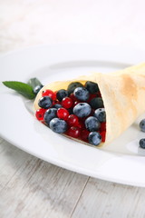 Pancakes with cream and fresh blueberries 