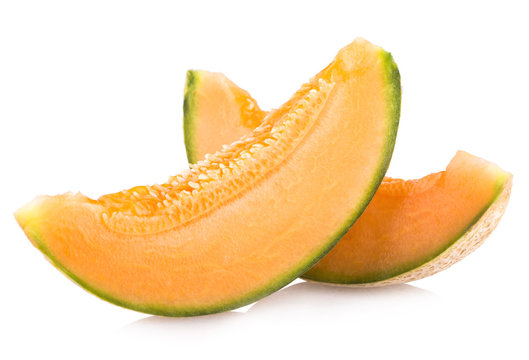 cantaloupe melon slices isolated on white background