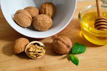 Nuts with honey on table