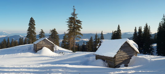 House in the mountain valley in the winter time