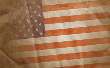 Fototapeta na wymiar Vintage bent faded paper american flag background