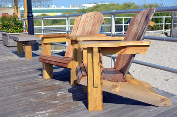 Adirondack style chairs on the boardwalk