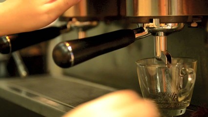 Espresso machine brewing a coffee espresso