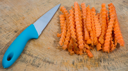 Carrots sliced on a cutting board.