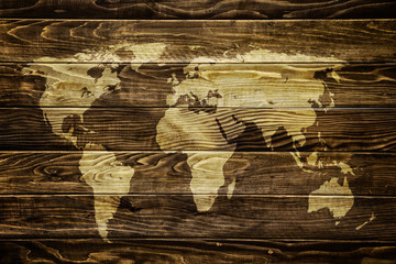 World map on wood background