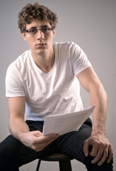 young Men reading a contract