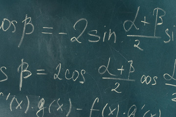 Fototapeta na wymiar Math formula written on blackboard with chalk.