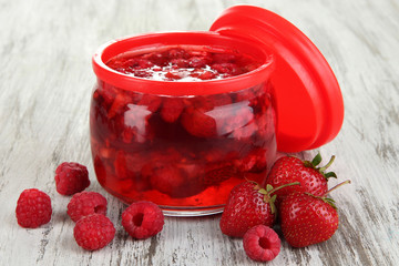 Home made berry jam on wooden table