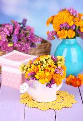 Bouquet of marigold flowers in watering can