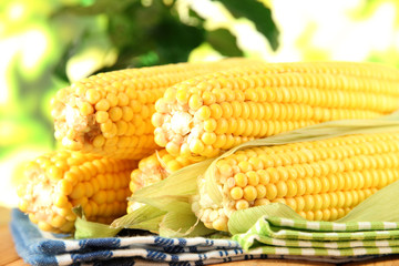 Crude corns on napkin on wooden table on window background