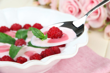 Sweet cream soup with fresh raspberry and sour cheese,
