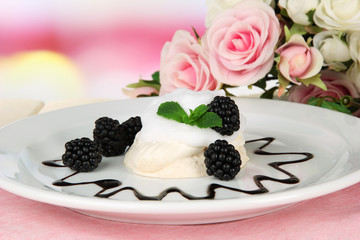 Tasty meringue cake with berries on table