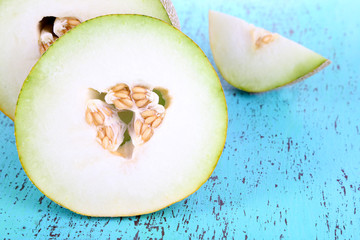 Ripe melons on wooden table close-up
