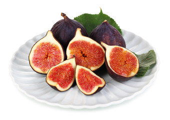 Ripe figs on plate  isolated on white
