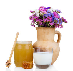 Honey and milk isolated on white