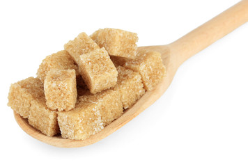 Brown sugar in spoon isolated on white