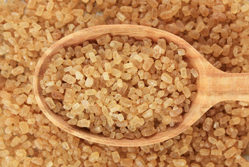 Brown sugar in spoon close-up