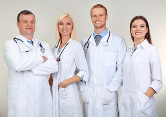 Fototapeta premium Medical workers on grey background