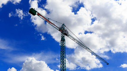 Crane working on blue sky