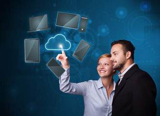 Happy couple touching cloud service