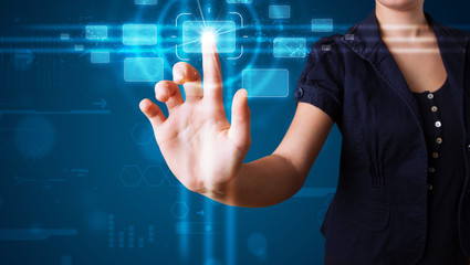 Woman pressing high tech type of modern buttons