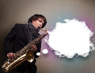 Obraz na płótnie Canvas Young man playing on saxophone with copy space in white cloud
